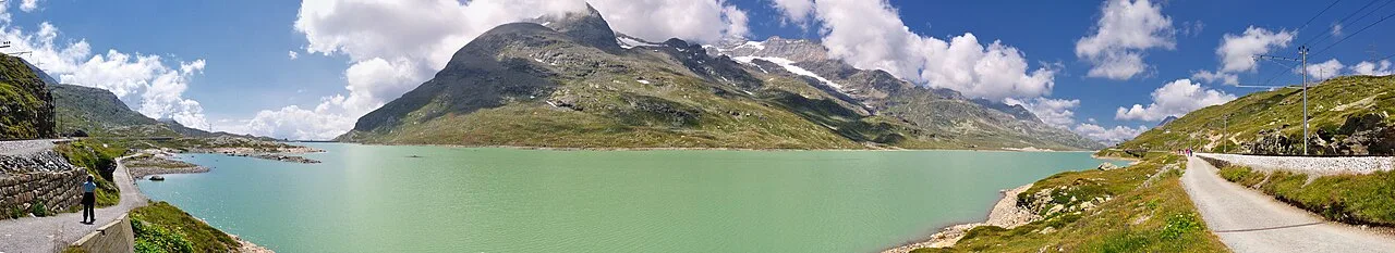 Lago Bianco — NOTE: This image is a panorama of Lago Bianco consisting of 6 frames that were merged or stitched in Panorama Studio. As / Wikimedia Commons / CC BY-SA 3.0